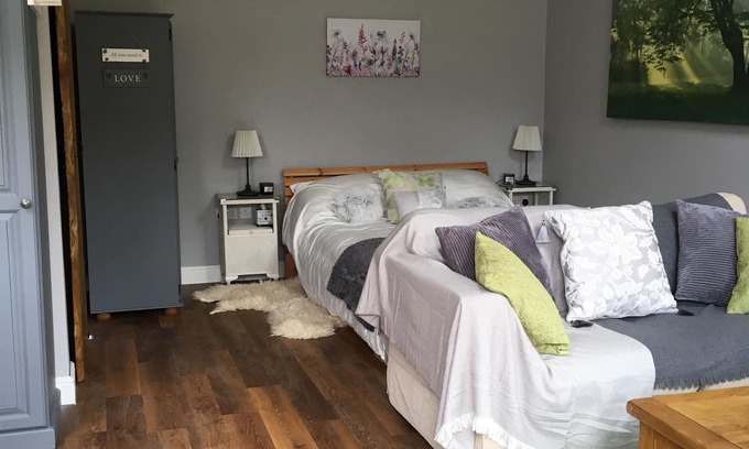 Sandy Lane Cabin | Lovely Wooden Lodge, views over an orchard, outside seating.