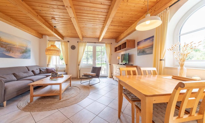 Tannenhausen House | Lüttje Huck vacation apartment 1 - with lake view & sauna
