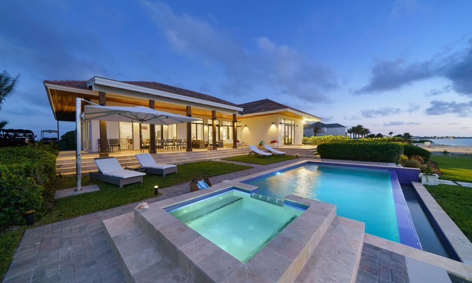 Alice Town House | Luxurious Beachfront Home with pool—short golf cart ride away from Hilton casino
