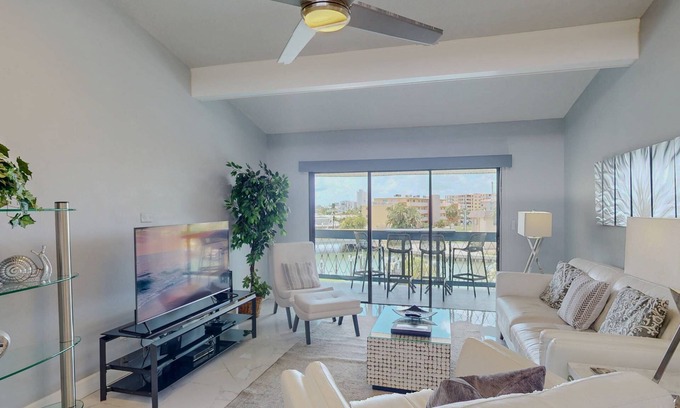 Capri Isle Condo | Luxurious Coastal Condo with Waterway Views, Pool, Balcony, and Steps to Treasure Island Beach.