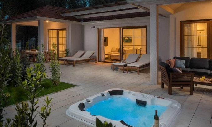 Bale House | Luxury Bay Villa with private hot tub by Interhome
