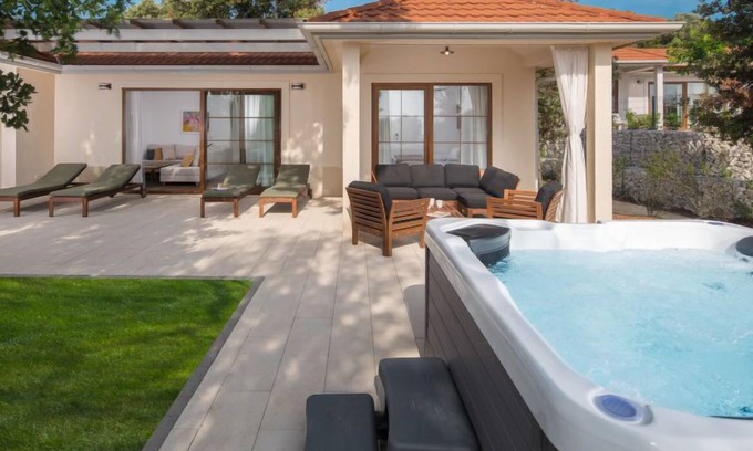 Bale House | Luxury Bay Villa with private hot tub by Interhome