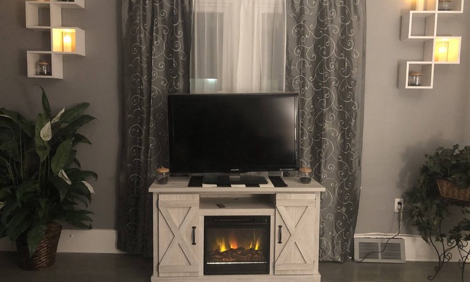 Niagara Falls House | Luxury Cali King Suite · Smart TVs & Wireless Charging in Every Room