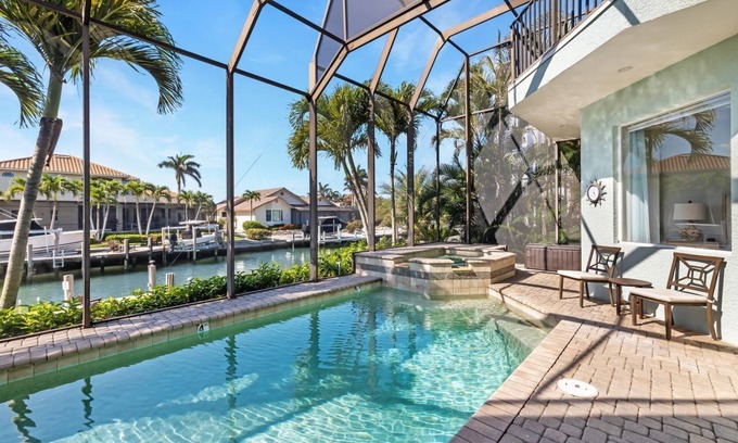 Marco Island House | Luxury Home, Heated Pool & Spa on Canal, Walk to the Beautiful Sands of Tigertail Beach!