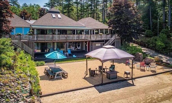 Milton House | Luxury Lakehouse with Large Private Beach, Hottub, Tiki Bar, 100’ Covered Deck, and Dock