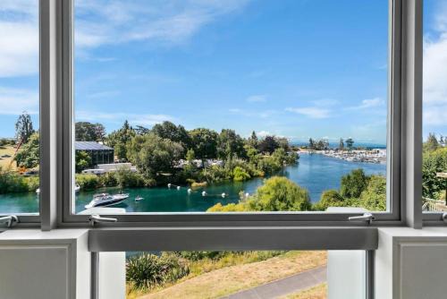 Taupo Apartment | Luxury Riverfront Apartment With Views and Pool Access