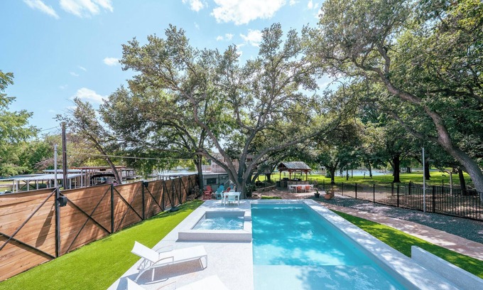 Kingsland House | Luxury WATERFRONT home with HEATED POOL AND SPA Sleeps 28+