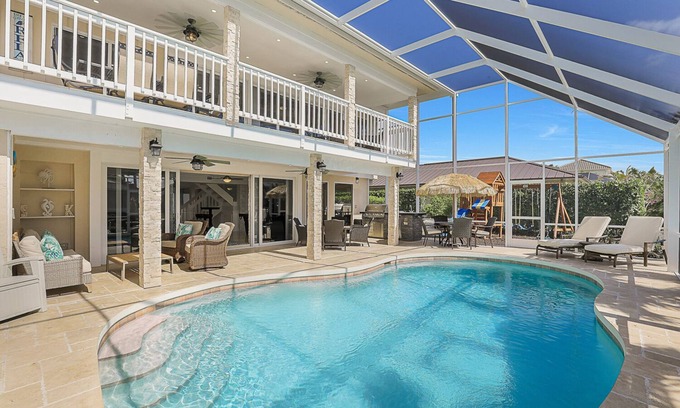 Marco Island House | Luxury WaterFront Pool Home, Beach Parking, Kayaks SUP's Bikes Pool/PingPong Tbl