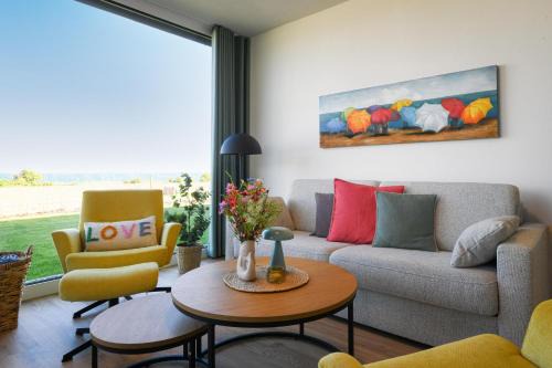 Marienleuchte Apartment | Lykke – Traumhafte Ferienwohnung mit Garten und Meerblick in erster Reihe!