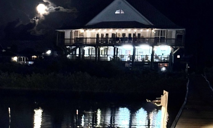 Grand Isle House | Majestic bayfront home. 450’ pier w/boat access, crabbing, fishing, & swimming.