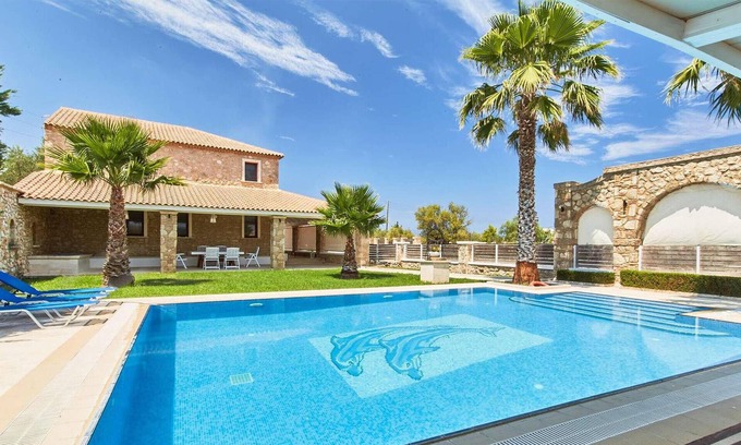 Drosia House | Make the most of the outdoor life at this beautifully designed villa with its stunning pool, covered