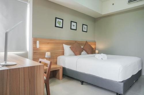 Cikarang Apartment | Minimalist and Cozy Stay 1BR Apartment at Mustika Golf Residence By Travelio