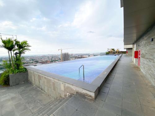 Semarang Apartment | Minimalist Studio Room Marquis de Lafayette Apartment By Travelio