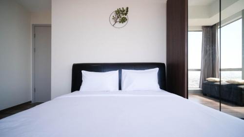 Surabaya Apartment | Minimalist with Beautiful View 2BR at Grand Sungkono Lagoon Apartment By Travelio