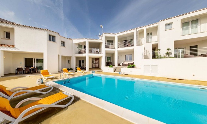 Monte Petrosu Apartment | modern apartment 5 min from the sea with swimming pool, air conditioning and wi-fi