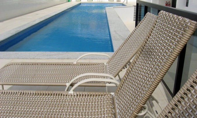 Armacao Apartment | Modern fully-furnished apartment with swimming pool, gym and game room.