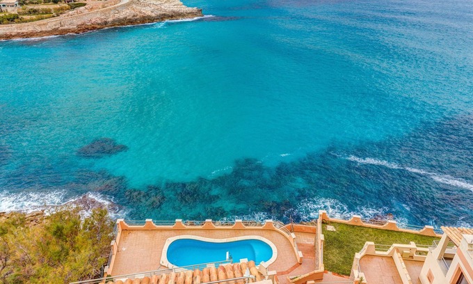 Cala Carbo Apartment | Modern Holiday Apartment with Sea View, Pool, Balconies, Air Conditioning and Wi-Fi