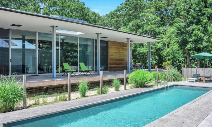Springs House | Modern home sited on a lush wood acre, stunning pool, covered deck, outdoor.
