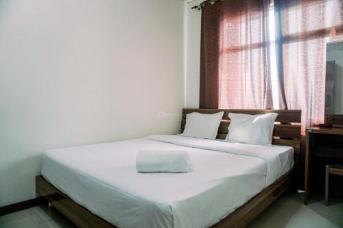 Pluit Apartment | Modern Look 1BR Green Bay Condominium Apartment By Travelio