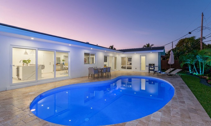 Imperial Point House | Modern Oasis, Heated Pool, Short Drive to Beach