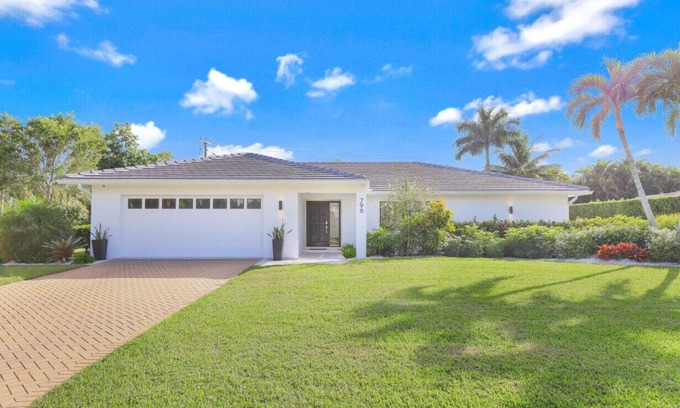 Moorings House | Modern Oasis: Private Beach Access. Minutes from Downtown & Optional Golf Cart