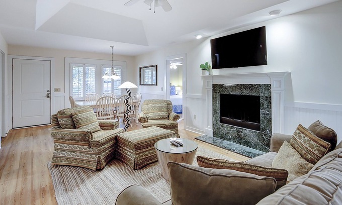 West Beach Condo | Modern, one-level condo near beach & golf with deck, sunroom, & pool