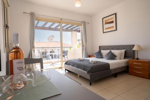 Peyia Town Apartment | Modern Studio with Pool and Balcony Hillside and Sea Views