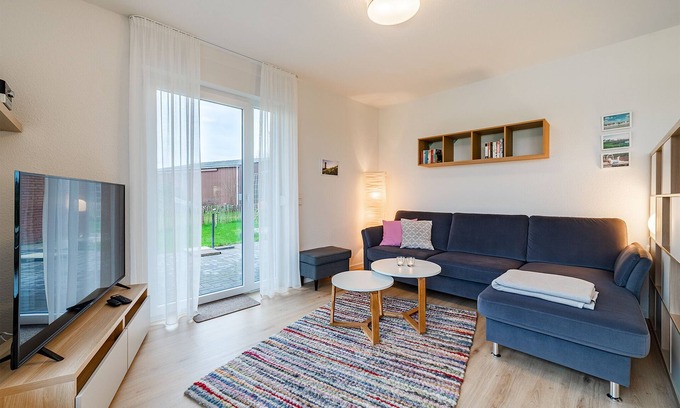 Greetsiel Apartment | Modern "Stuuv" vacation apartment with a view of the Greetsiel twin mills