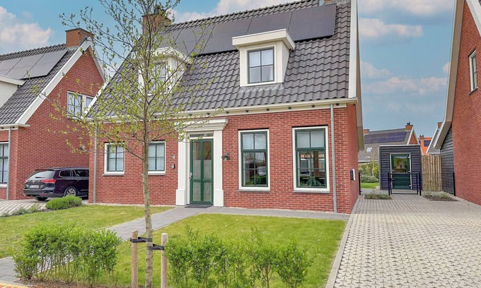 Colijnsplaat House | Modern villa with a sauna, hot tub, and a garden