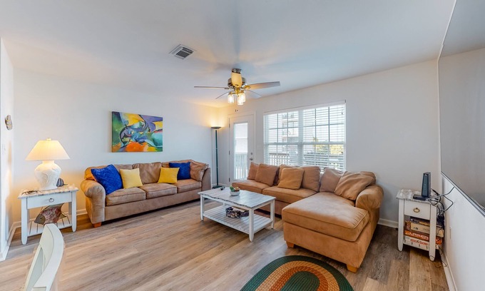 Gulf Shores Condo | Modern waterfront condo with balcony & outdoor pool - beach across the street
