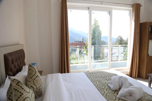 Tapovan Apartment | Mountain Facing Room by yog Tapovan