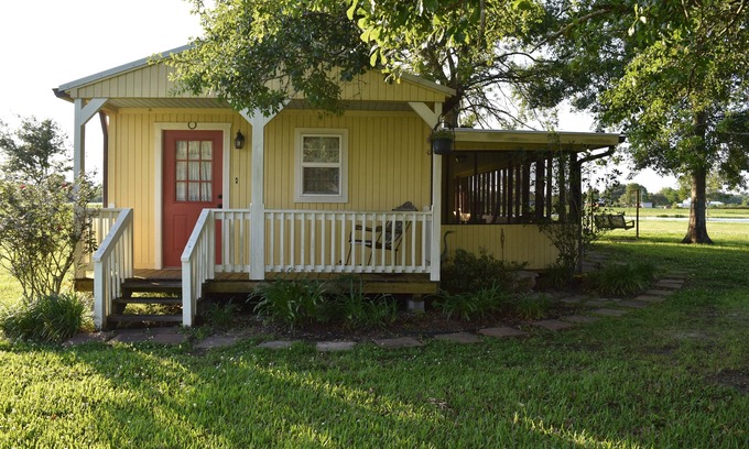 Breaux Bridge Cabin | "My Playhouse" Enjoy the country views from the wrap around screened porch
