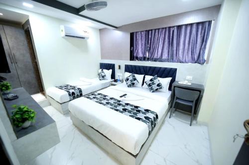 Versova House | N M Hotel Nr kokilaben Hospital