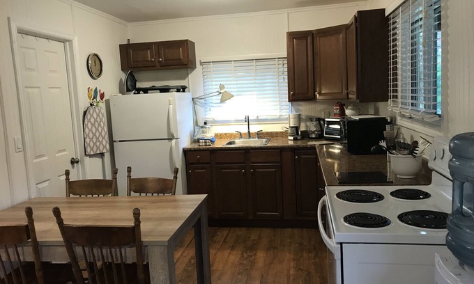 Milford Cottage | Nature Lover's Cottage Retreat On The Black River With Private Dock.