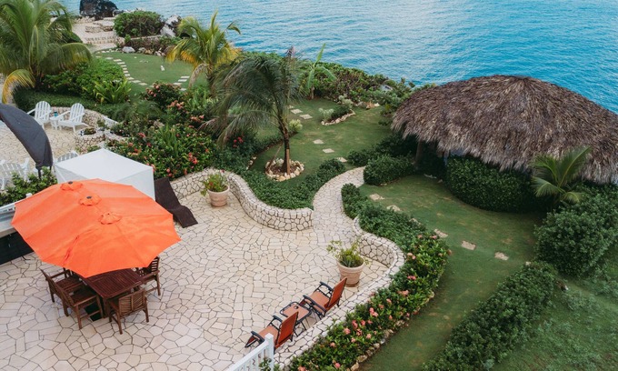 Orange Bay House | Negril Bungalow Paradise overlooking cliffs with Private Snorkeling Entrance.