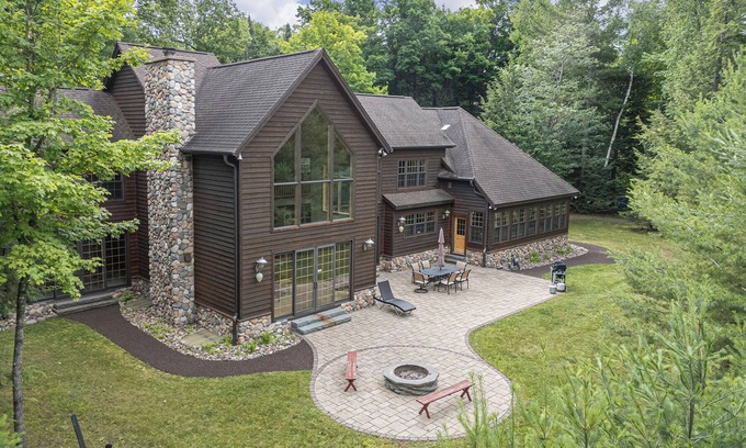 Manitowish Waters House | New Listing! Don’s Bay Estate | Lakefront Luxury with Dock, Trails & Fire Pit