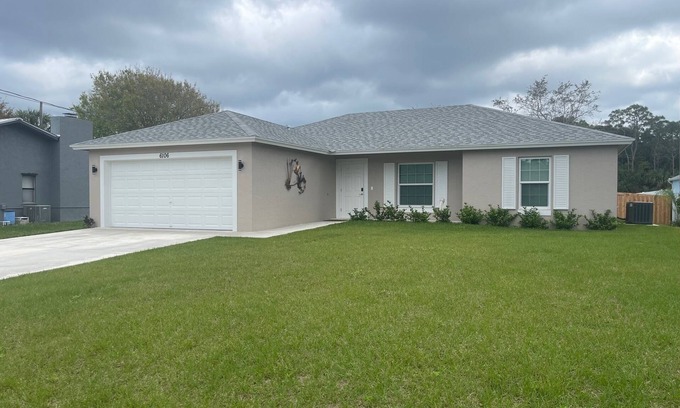 Indian River Estates House | New modern 3-bed 2 bath house with smart TV's in every room, WIFI, and hot tub