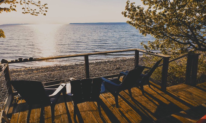 Lake Leelanau Cottage | NEW! Waterfront Cottage on private Lake Michigan Beach with glorious sunsets