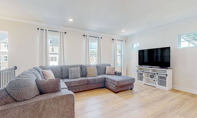 Ocean City House | Newly built row-end townhome with water view, pool access, patio, & balcony