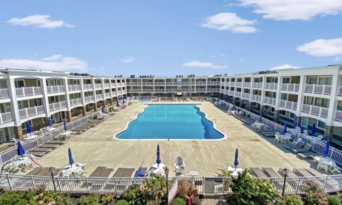 Normandy Beach Condo | Newly Renovated, Beachfront Family Oasis with Private Guarded Beach and Pool
