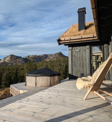 B House | Nydelig hytte med badestamp og sauna