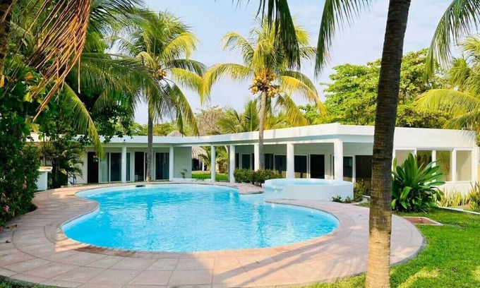Monterrico House | Ocean access waterfront home with TIKI Ranch and Pool. Pet friendly!