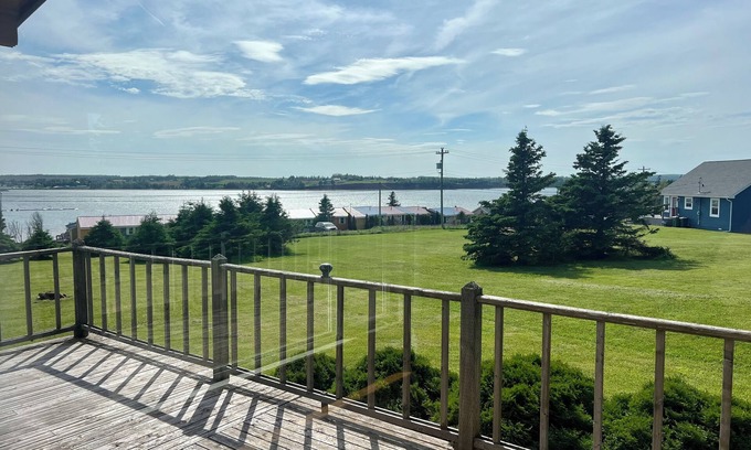 Bayview Cottage | Ocean view cottage with a perfect wrap around deck to watch beautiful sunsets.