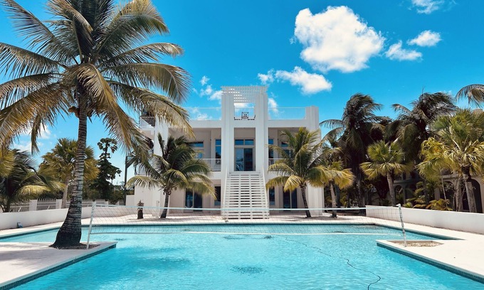 Sandy Point Villa | Oceanfront Dream Villa. Expansive pool, game room, rooftop lounge, kitchen.
