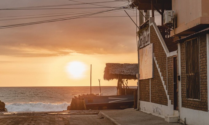 Coastal Region Hotel | Oceanfront Hostel - Balcony with amazing ocean sunset views, pool and Steam Room