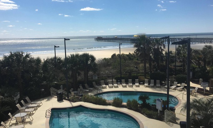 Arcadian Shores Condo | OCEANFRONT OASIS. Waves echo throughout this cozy family condo.