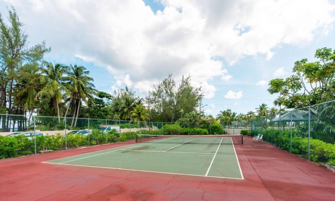 Rum Point Condo | Oceanfront right next to RumPoint, tranquility,pool,gym,tennis court and sunsets