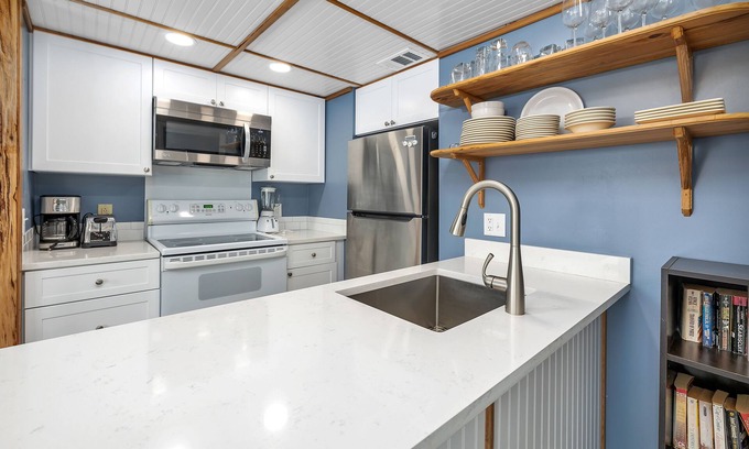 Saint Simons Island Condo | Oceanfront Condominium with Balcony, Pool and Boardwalk to Beach. Partial Ocean View