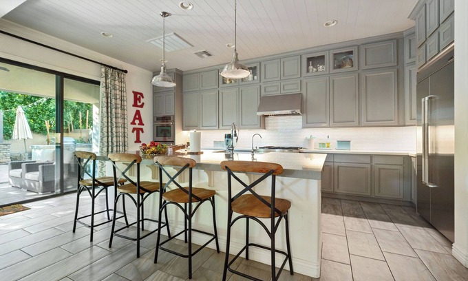 Chandler House | Olive Treeside, a luxury oasis with a pool, pizza oven, grill, fireplace