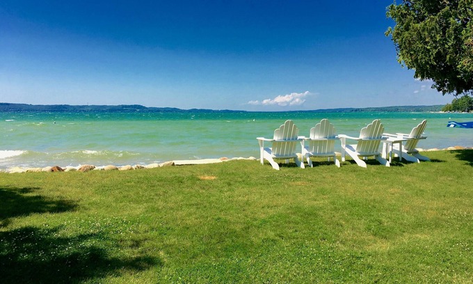 Clam River Cottage | ON TORCH LAKE SANDY BEACH COTTAGE HOME! AMAZING SUNSETS! LARGE YARD JUST OPENED